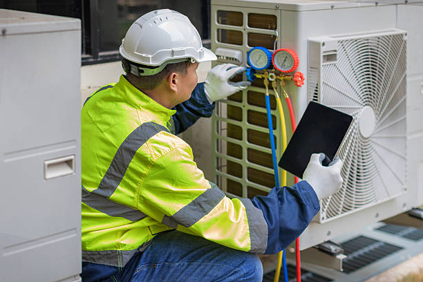 Professional Heat Pump Repair technician working in Plainville, NY